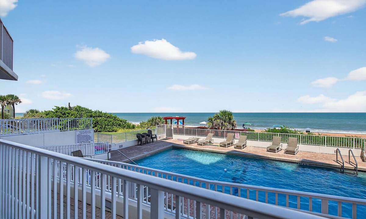 Seawinds Condo Condo | Ground floor direct oceanfront 2/2 with a balcony, heated pool, and garage parking