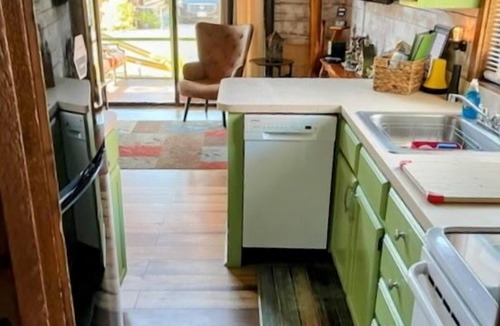Okeechobee Cabin | Charming gingerbread style lakeside cabin on Lake Okeechobee