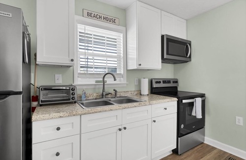 Surf City Cottage | Cozy Cottage steps from the beach small pet friendly