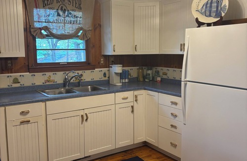 Osage Beach Cottage | Cozy wooded 2-bedroom cottage on the lake in Osage Beach