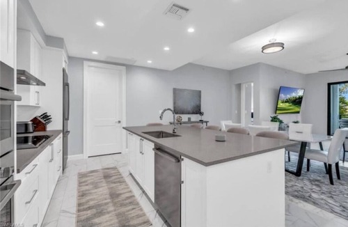 Redevelopment Area Condo | Experience true luxury with this chic and modern condo in Naples.