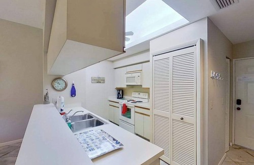 Bonita Bay Condo | Gated resort community condo with water views, pool, hot tub, & balcony