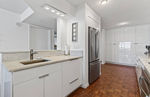 Seawinds Condo Condo | Ground floor direct oceanfront 2/2 with a balcony, heated pool, and garage parking