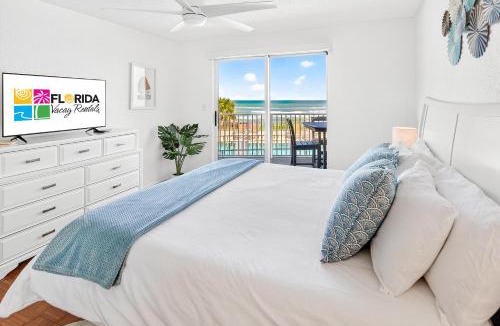 Seawinds Condo Apartment | Ground floor direct oceanfront 2/2 with a balcony, heated pool, and garage parking