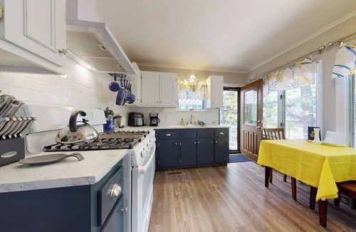 The Bays House | Homey lakeside property w/one house, two cottages, mtn. views, & private beach