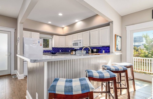 South Beach House | Ocean front duplex with master balcony overlooking the beach; newer six passenger golf cart