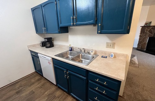 Russian Jack Park Condo | One bedroom top floor condo with Mountain View from bedroom and covered parking