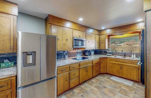 South Fork House | Spacious cabin with river views, private hot tub, sun room, and full kitchen!
