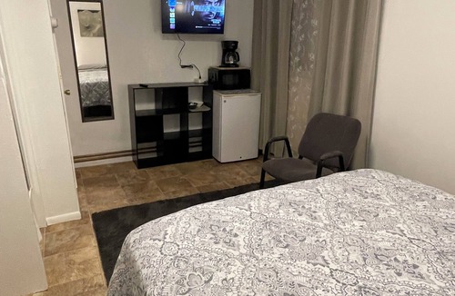 Fairbanks Apartment | Studio with a Queen bed, shower cabin and toilet, shared access to free laundry