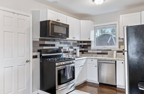 Westmont House | Super Sleek large Tiny house by Westmont Metra large enclosed yard and parking.