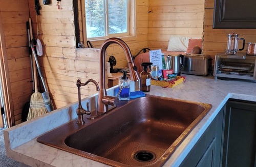 Sutton Cabin | The Polaris is a cozy delight with 360 degree mountain views. Pet Friendly!