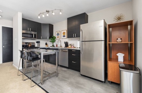 Grandview Heights Apartment | Updated flat with parking and laundry in an exceptional location