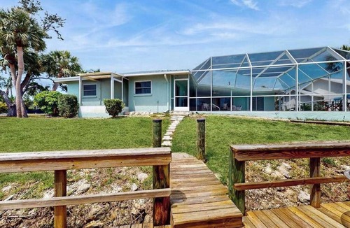 Sorrento Shores House | Waterfront home with pool dock accessible to Gulf dog friendly with AC & WD