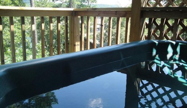 C16, Two bedroom, two bath, log-sided Harbor North luxury cottage with hot tub overlooking Lake Ouachita