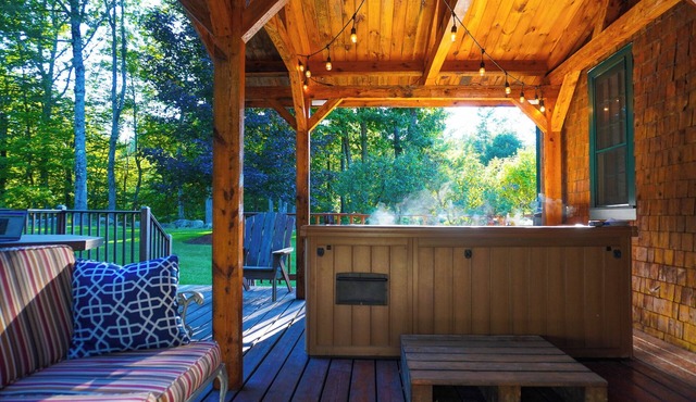 Central Escape is a spacious Lakes Region retreat just 5 minutes from downtown Meredith, less than a mile to Squam Lake and 20 minutes to concerts at the Bank of New Hampshire Pavilion. Enjoy the private year-round hot tub, fire pit, yard games!