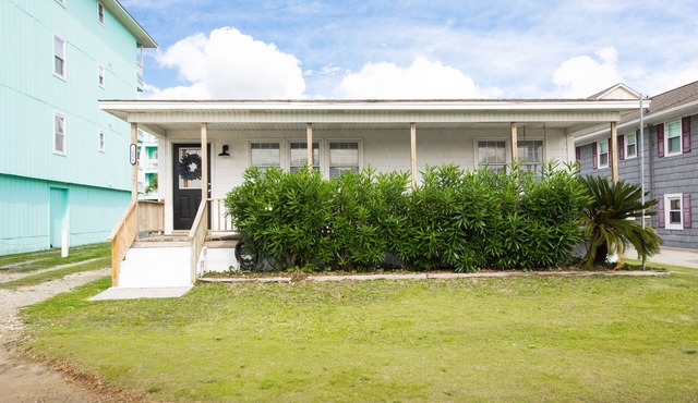 Classic Beach Cottage with front porch view of water