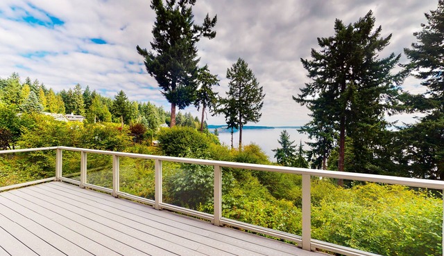 Sound view home full of vintage charm with game room, wood stove, & gas grill