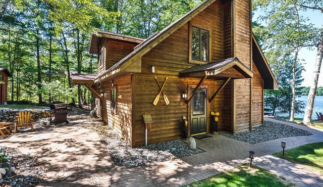 Waterfront getaway with wood fireplace, dock, & lakeside deck