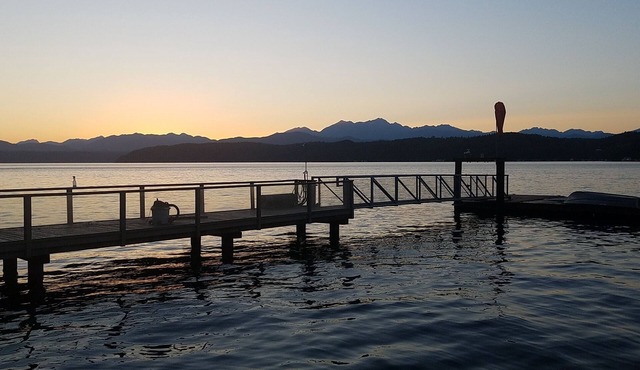 Waterfront home with dock, spacious deck & picturesque views